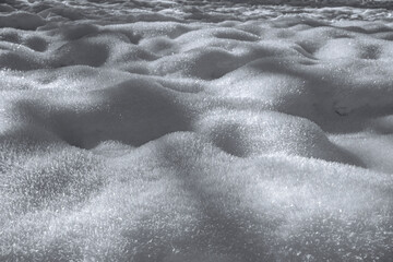 Texture of white snow falling in the mountains 