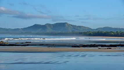Obraz premium Landscape with a beach in front of the mountains in Tamarindo, Costa Rica