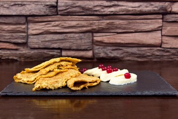 Oat pancakes with soft cheese and cranberries.