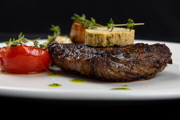 Grilled black angus strip loin steak with vegetables