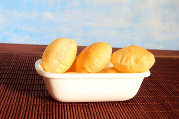 indian gujarati traditional food puri or poori fried roti in bowl