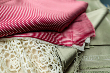 Fabric ready-made suit textile shades in the workplace, tailor or tailor, close view, atelier