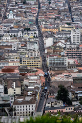 Cityscapes of the capital of Ecuador - Quito from the mountain on a cloudy day 