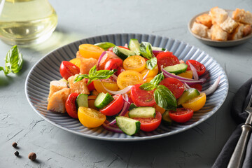 Tuscan Panzanella with tomatoes and bread. Concept for a tasty and healthy meal. Close up. Italian cuisine.
