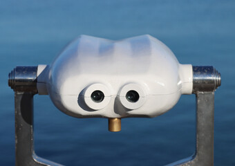 coin-operated binoculars to watch scenic landscape