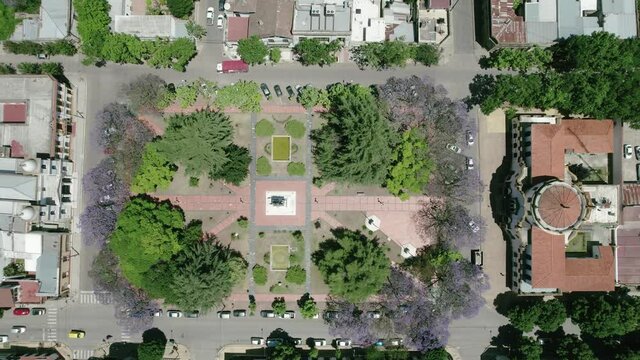 Aerial view of the central square of Chascomus, a city located in the province of Buenos Aires, Argentina. Full of green trees and its immense lagoon.
