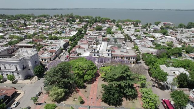 Aerial view of the central square of Chascomus, a city located in the province of Buenos Aires, Argentina. Full of green trees and its immense lagoon.
