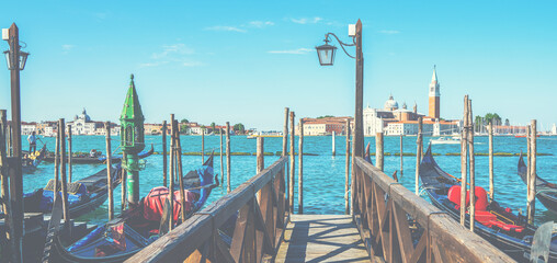 Gondolas moored. Grand canal on the background Venice, Italy. Architecture and landmarks of Venice.