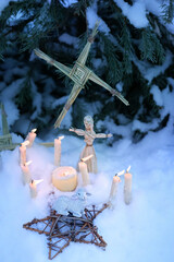 Wiccan altar for Imbolc sabbath, pagan holiday ritual. Brigid's cross of straw, candles, witch...