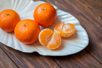 juicy tangerine fruits on a plate