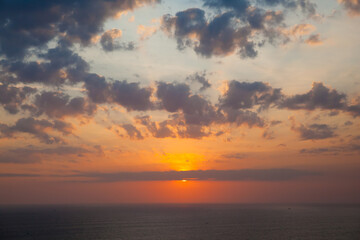 Beautiful sunset over the sea. Seascape. The sun is setting over the horizon.