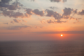 Fototapeta na wymiar Beautiful sunset over the sea. Seascape. The sun is setting over the horizon.
