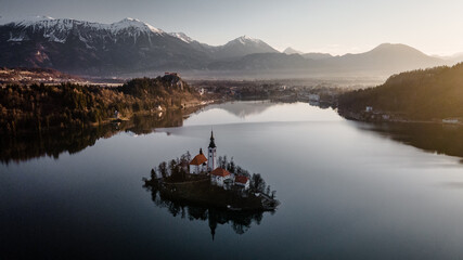 Panorama of lake bled during sunrise. Lake bled Castle in the background.