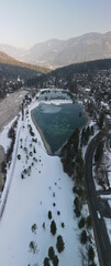 Drone view of famous lake Jezero Jasna, glowing julian alps in the background, Slovenia