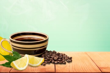 Lemon black coffee in cup, coffee beans, lemon slices