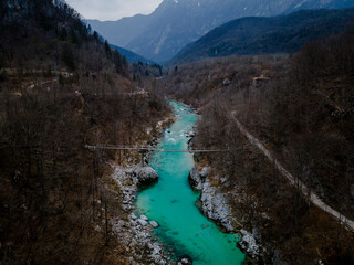 Fototapeta premium Landmark in Slovenia - turquoise Soca River, julian alps in the background