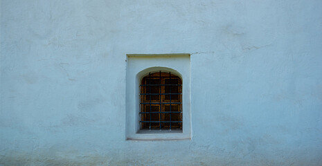Background of castle wall. Old wall with window. Wall texture. Graphic texture element.