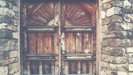 View of a beautiful exterior of old building and front door on a Venice street. Vintage tone filter effect with noise and grain.