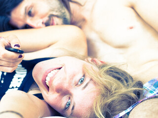young couple making a self portrait at home