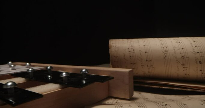 vibraphone lying on sheet music. SLIDER SHOT