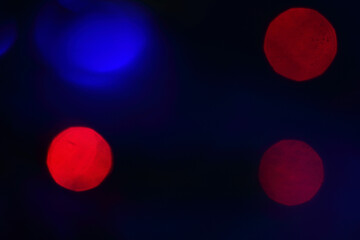 abstract background blured blue and red lights on dark background