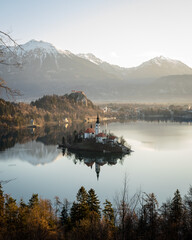 Panorama of lake bled during sunrise. Lake bled Castle in the background.