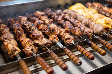 shish kebab meat from skin and beef on the grill on skewers