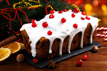 Christmas cake with cranberries. Christmas homebaked. Christmas stollen and Christmas decorations