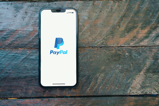 PayPal App On The Smartphone Screen On The Rustic Wooden Table In The Park. Top View. Rio De Janeiro, RJ, Brazil. January 2022