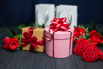 pink surprise gift box with red bow for birthday and happy valentine's day with flowers roses