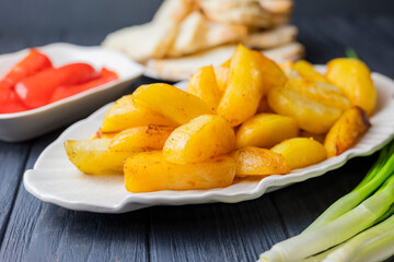 delicious fried dish baked potatoes on a plate