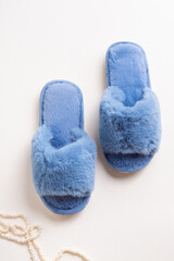 Blue women's home slippers. Fluffy soft slippers. Top view