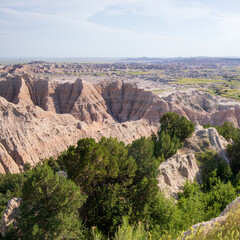 Pinnacles Overlook in Badland national park during summer. From grassland to valley. Badland landscape South Dakota.