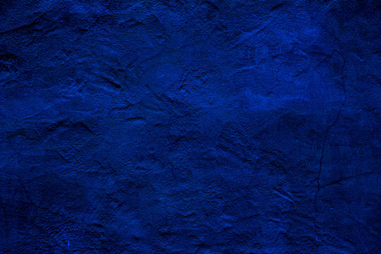 Blue colored abstract wall background with textures of different shades of blue