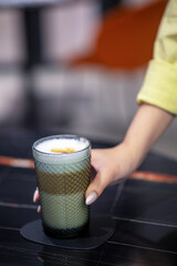 Close up picture of a glass with cappuccino