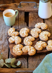 Almond cookies with almond chips. Wooden background, top view
