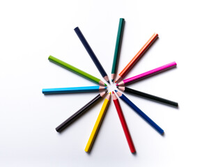 colored pencils forming a sun isolated on a white background, geometric shapes on a white background