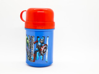 Fototapeta premium Thermos for children's drinks. Plastic bottle with glass included. School supplies. Spider-Man. Avengers Assemble. Captain America. Toy. Comic. Movies. Peter parker. Superhero. Super heros.