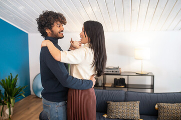 Man and woman dancing looking at each other