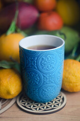 Fruits bergamot, pomegranate, lemon, pamelo, pear, tangerine, mango on a wooden background.
