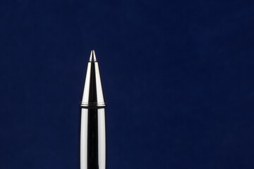 Roller Ball Pen Point on a Blue Background