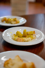 Tasting of Italian extra virgin olive oil with bread on organic farm in Tuscany, Italy