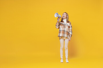 Full body little blonde caucasian kid girl 13-14 years wearing checkered shirt hold scream in...