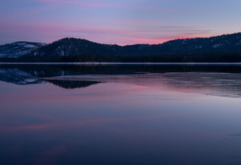 Fototapeta na wymiar Snow and Ice; Winter Sunset on Lake Almanor 