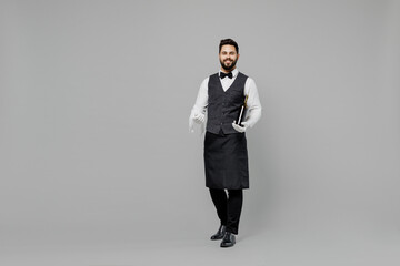 Full body young barista male waiter butler man 20s wear white shirt vest elegant uniform work at...