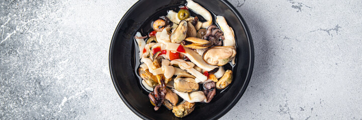 seafood salad mussels, squid, octopus, shrimps meal food snack on the table copy space food background