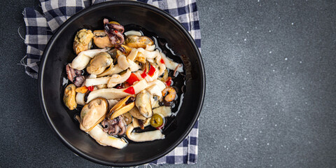 seafood salad mussels, squid, octopus, shrimps meal food snack on the table copy space food background