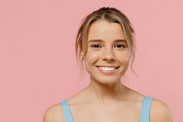 Close up young beautiful smiling happy fun woman 20s wearing blue tankshirt looking camera isolated...