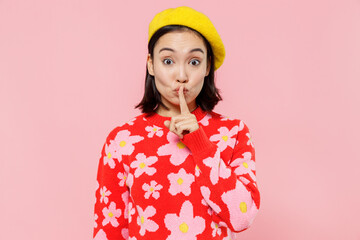 Secret woman of Asian ethnicity 20s wearing red knitted sweater beret say hush be quiet with finger...
