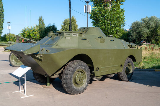 Combat reconnaissance landing vehicle. BRDM 2 in the Victory Park in Nizhny Novgorod, exhibited as an exhibit surrounded by green trees. High quality photo